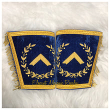Load image into Gallery viewer, Blue House Worshipful Master Masonic Cuffs. Blue Velvet. Gold embroidered masonic symbol. Gold braided fringe trims the cuffs shown closed.
