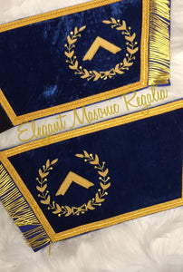 Blue House Worshipful Master Masonic (Event) Cuffs. Blue Velvet. Gold embroidered masonic symbol. Gold braided fringe trims the cuffs shown open. Design outlined in 100% Swarovski Crystals.