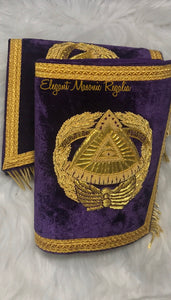 Deputy Grand Master Cuffs. Purple velvet. Gold embroidered masonic symbol. Gold braided fringe trims the cuffs shown closed.