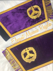 Grand Senior Warden Masonic Cuffs. Purple velvet. Gold embroidered masonic symbol. Gold braided fringe trims the cuffs shown open.