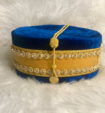 Load image into Gallery viewer, Side view of Past Master Masonic Crown (Blue House). Embroidered masonic symbol. Blue velvet. Gold rope to adjust size of cap.
